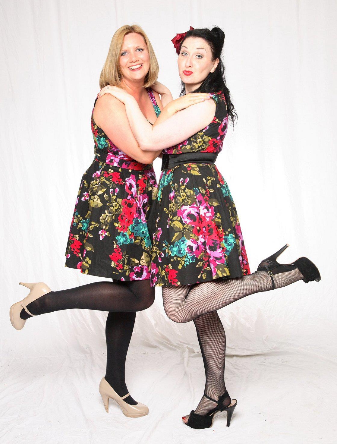 Two BBWs wearing Black Opaque Tights and Black Fishnet Pantyhose and Coloured Mini Dresses